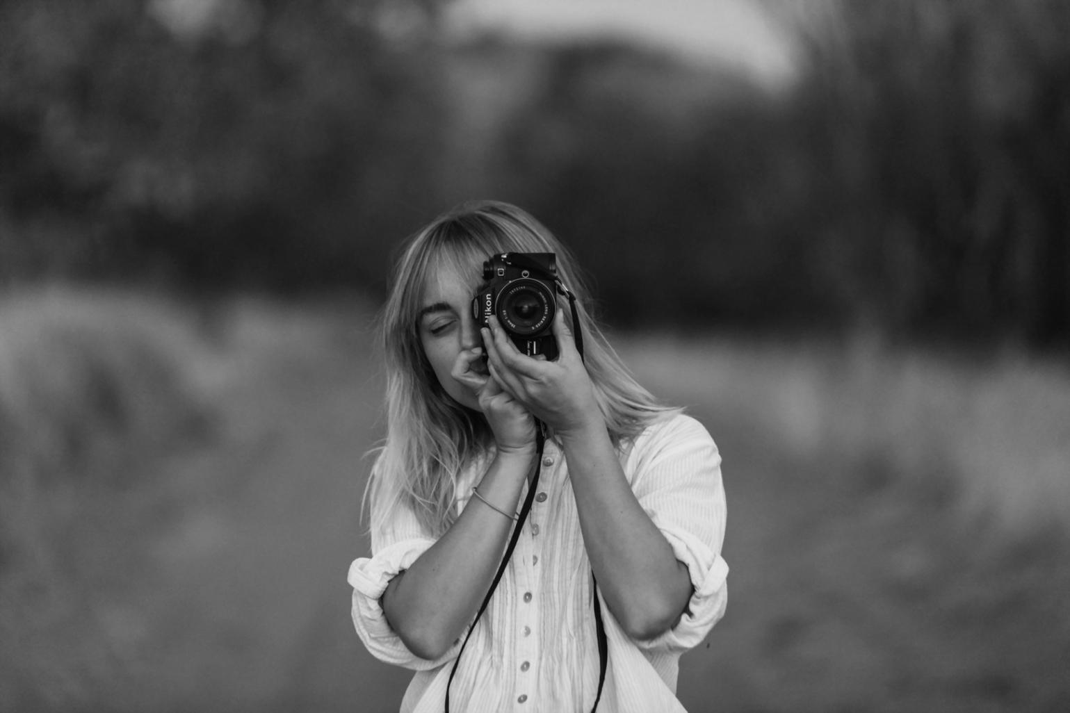 Photography training workspace with various lighting setups and composition demonstration areas